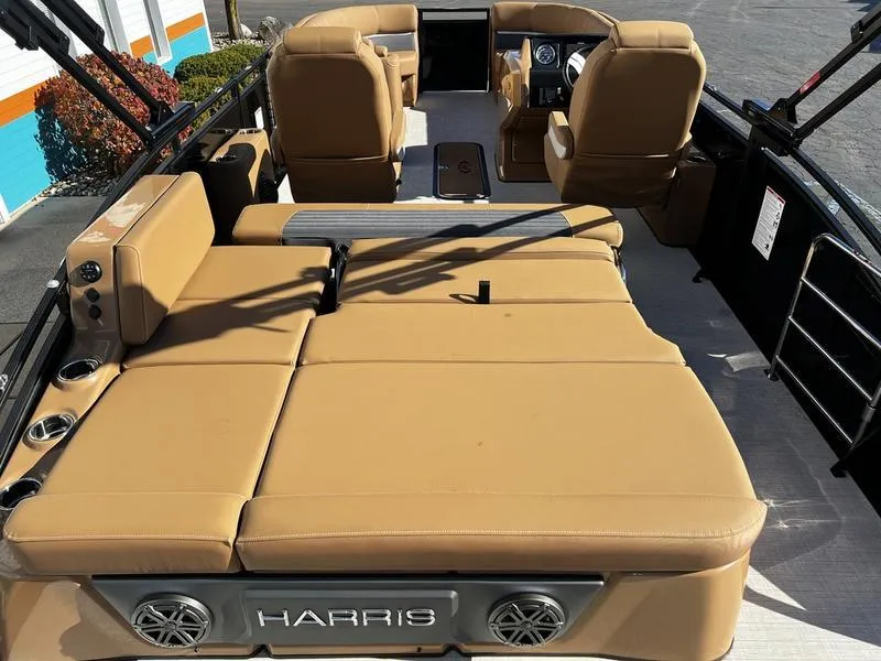 Slide: The Image of 2024 Harris Solstice 230 boat interior with tan seating and modern design. - 22