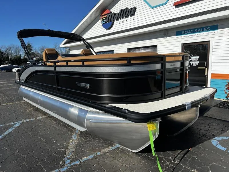 Slide: The Image of 2024 Harris Solstice 230 pontoon boat displayed at a dealership, showcasing sleek design and modern features. - 4