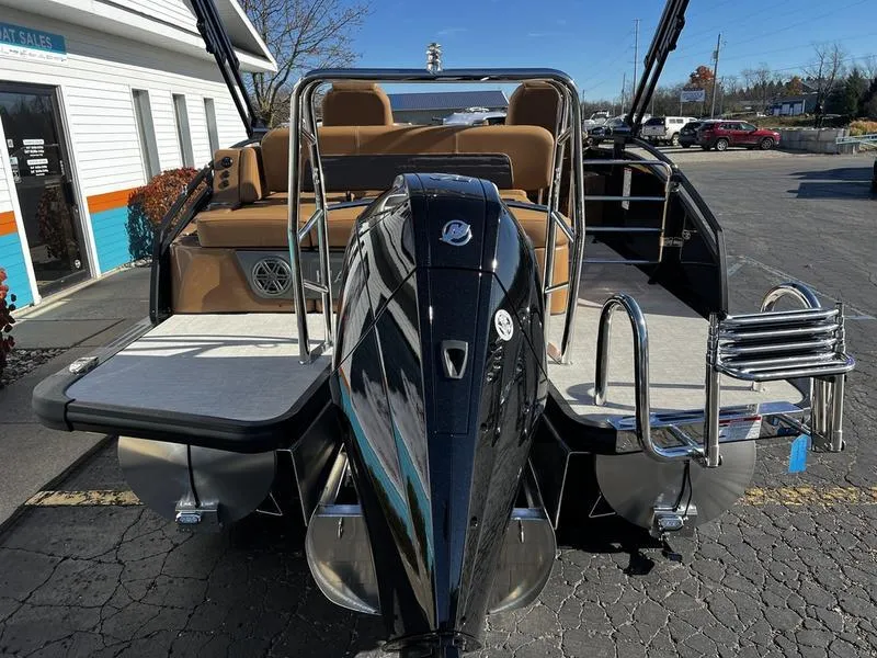 Slide: The Image of 2024 Harris Solstice 230 pontoon boat with powerful outboard motor, docked at marina. - 8