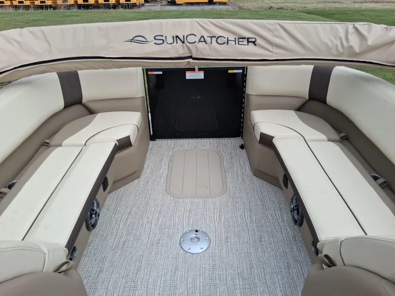 Slide: The Image of Interior of 2025 SunCatcher Select 324RC pontoon boat with beige seating and carpeted floor. - 8