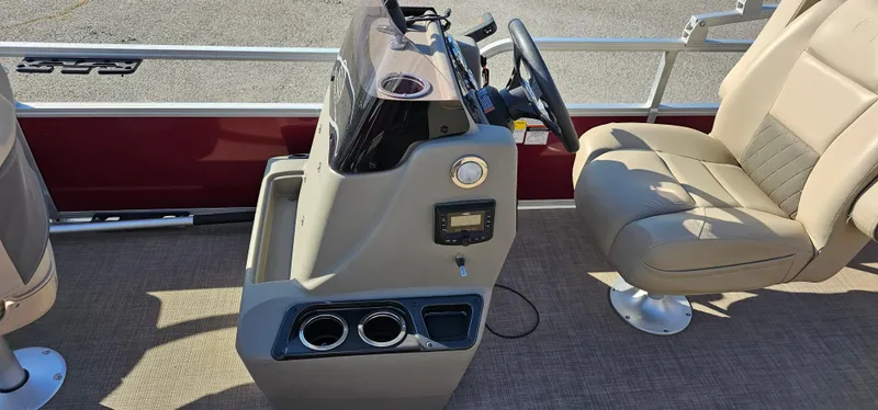 Slide: The Image of 2024 Sun Tracker BB-18 boat interior with steering console and seating. - 11