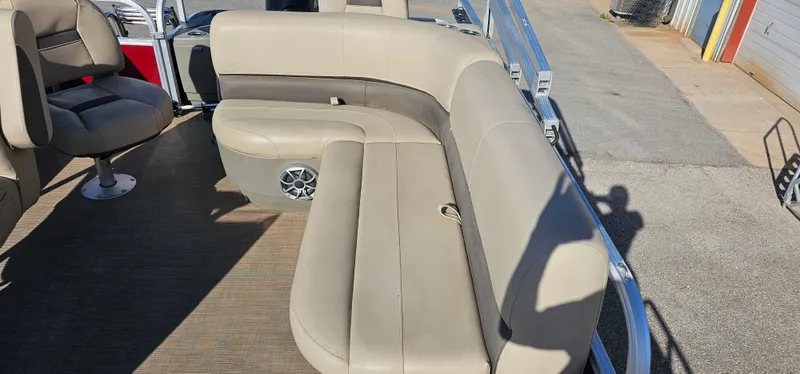 Slide: The Image of 2024 Sun Tracker BB-18 boat with beige seating and speaker on deck. - 18