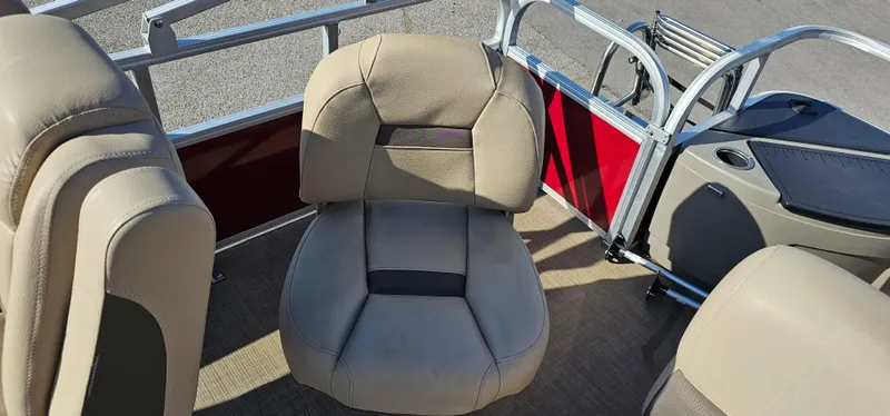 Slide: The Image of 2024 Sun Tracker BB-18 boat interior with beige seating and red accents. - 19