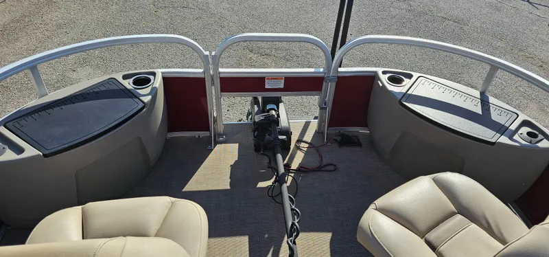 Slide: The Image of 2024 Sun Tracker BB-18 boat interior with seating and control panel. - 6