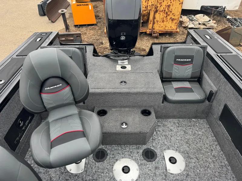 Slide: The Image of 2025 Tracker Targa V-18 Combo boat interior with gray seating and carpeted flooring. - 14