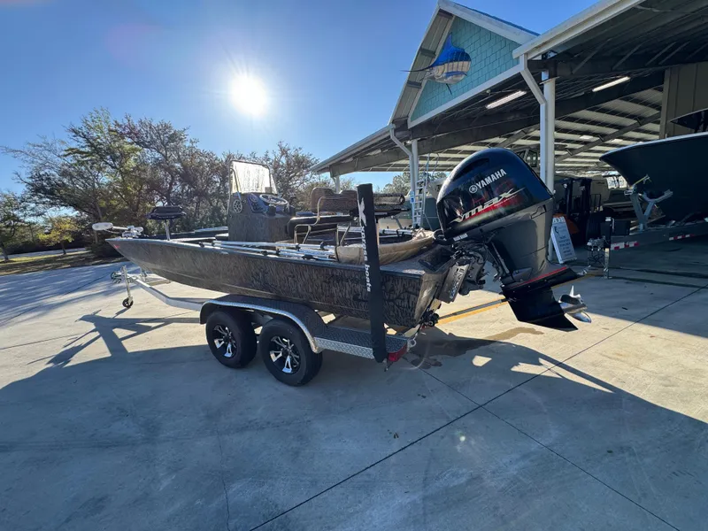 Slide: The Image of 2023 Xpress H22B boat with Yamaha engine on trailer, parked outdoors in sunlight. - 17