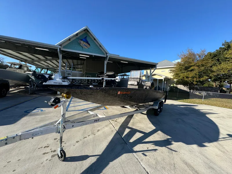 Slide: The Image of 2023 Xpress H22B boat on trailer in sunny outdoor setting. - 4