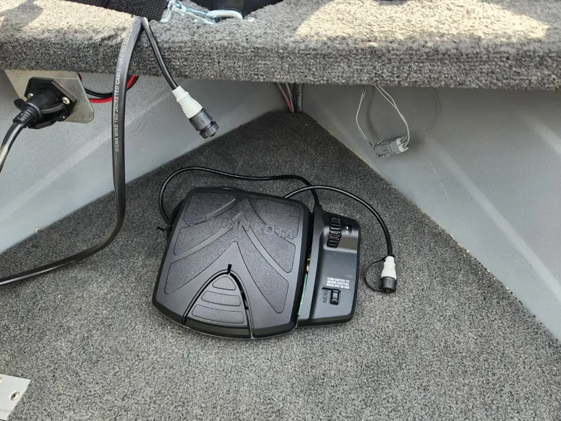 Slide: The Image of Foot pedal control on 2021 Starcraft 16 SF DLX boat, carpeted interior. - 10