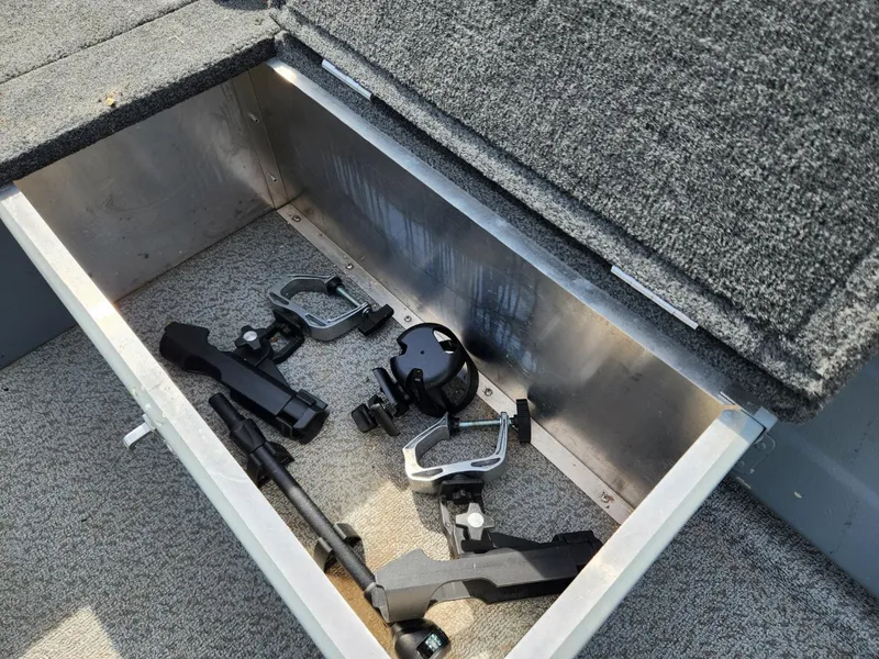 Slide: The Image of Storage compartment in a 2021 Starcraft 16 SF DLX boat with fishing equipment. - 6