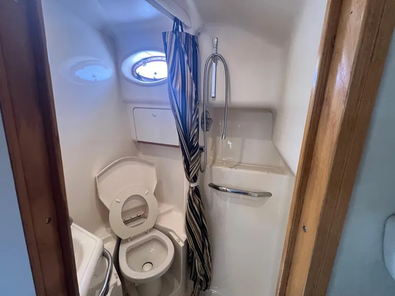 Slide: The Image of Bathroom interior of 1997 Sea Ray 450 Sundancer yacht with shower and toilet. - 10