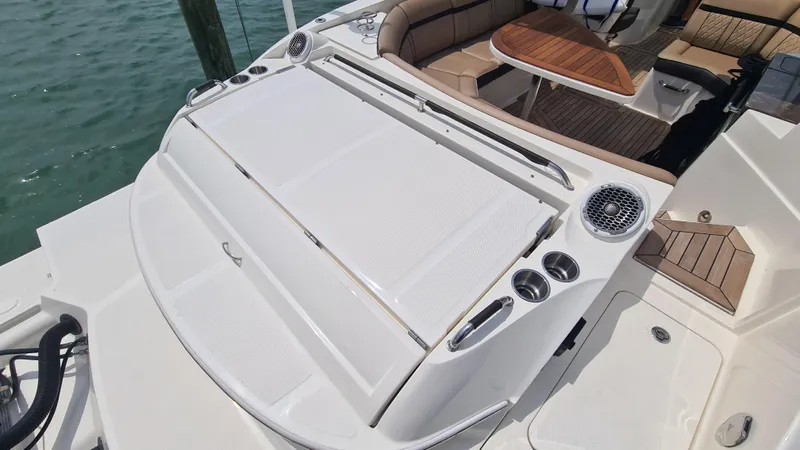 Slide: The Image of 2017 Sea Ray SLX 350 OB boat with spacious seating and sleek design. - 15