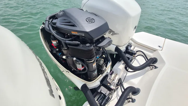 Slide: The Image of 2017 Sea Ray SLX 350 OB outboard engine on water, showcasing mechanical details. - 21