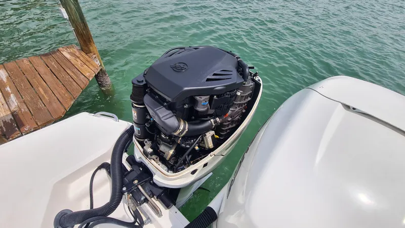 Slide: The Image of 2017 Sea Ray SLX 350 OB outboard engine near wooden dock on water. - 22