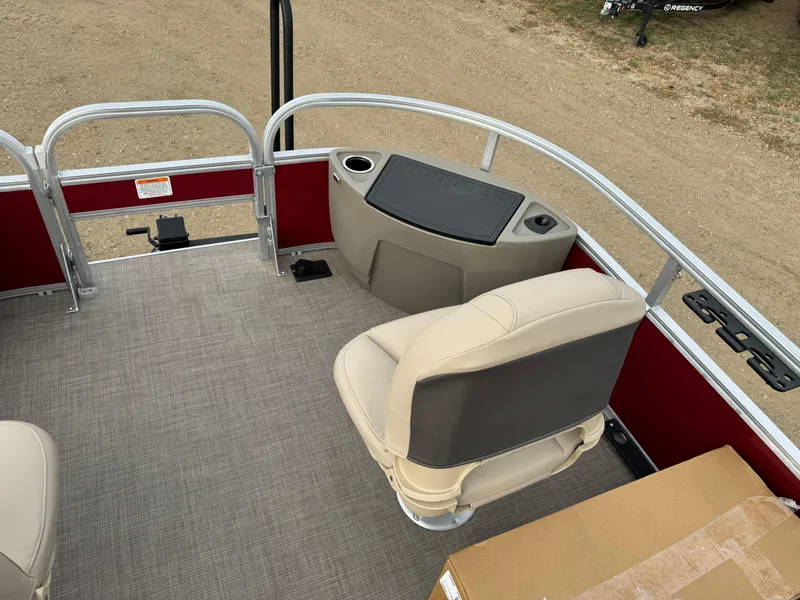 Slide: The Image of 2024 Sun Tracker Bass Buggy 18 DLX pontoon boat interior with seating and storage. - 10