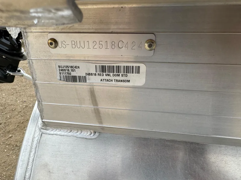 Slide: The Image of 2024 Sun Tracker Bass Buggy 18 DLX identification plate with serial and model details. - 12