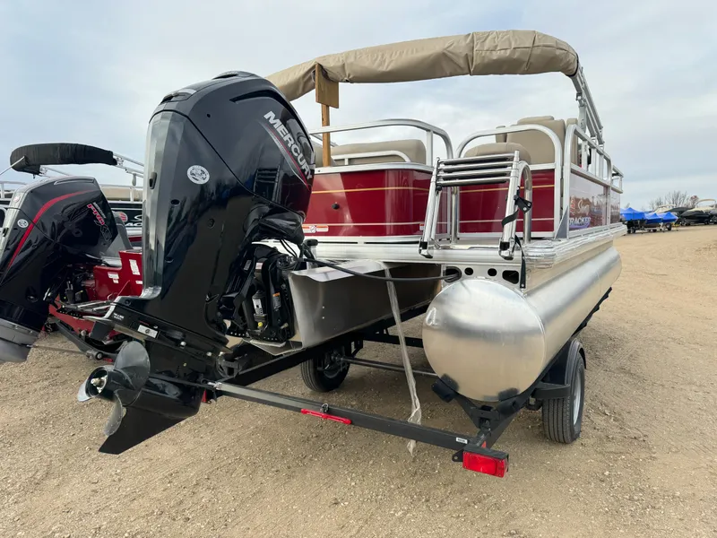 Slide: The Image of 2024 Sun Tracker Bass Buggy 18 DLX pontoon boat with Mercury outboard motor. - 3