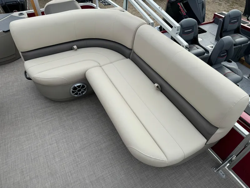 Slide: The Image of 2024 Sun Tracker Bass Buggy 18 DLX pontoon boat with beige seating and speaker. - 7