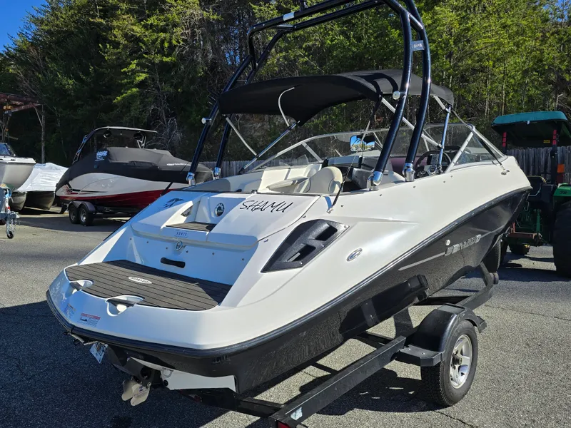 Slide: The Image of 2012 Sea-Doo Challenger 180 boat on trailer, parked outdoors. - 5