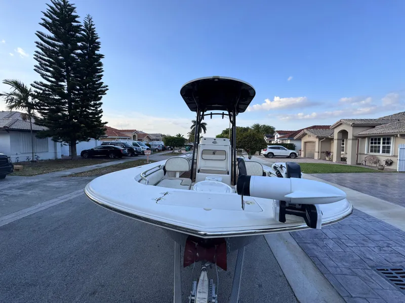 Slide: The Image of 2021 Carolina Skiff Ultra Elite 24 boat parked in suburban neighborhood street. - 10