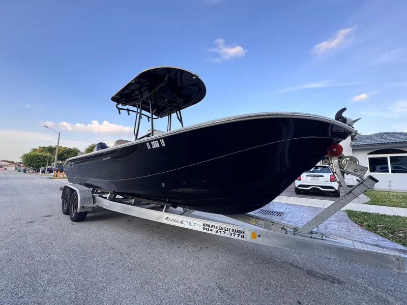 Slide: The Image of 2021 Carolina Skiff Ultra Elite 24 boat on trailer, parked on street. - 11