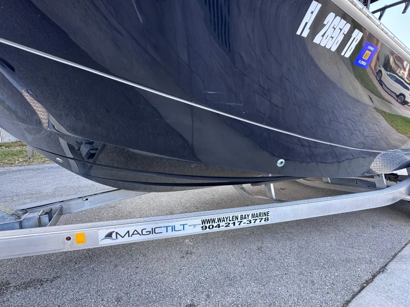 Slide: The Image of 2021 Carolina Skiff Ultra Elite 24 on Magic Tilt trailer, side view. - 14