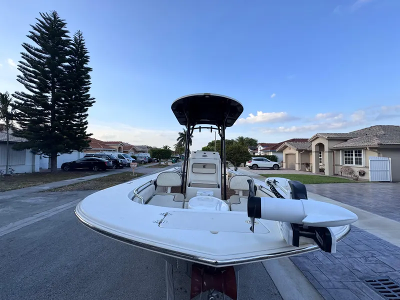 Slide: The Image of 2021 Carolina Skiff Ultra Elite 24 boat parked in a suburban neighborhood street. - 15