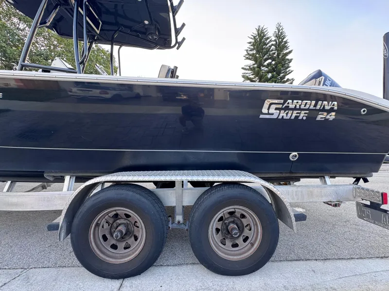 Slide: The Image of 2021 Carolina Skiff Ultra Elite 24 boat on a trailer, side view. - 16