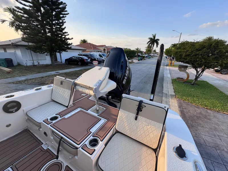 Slide: The Image of 2021 Carolina Skiff Ultra Elite 24 boat parked on a residential street. - 20