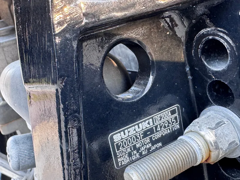 Slide: The Image of Suzuki motor part on a 2021 Carolina Skiff Ultra Elite 24 boat. - 23