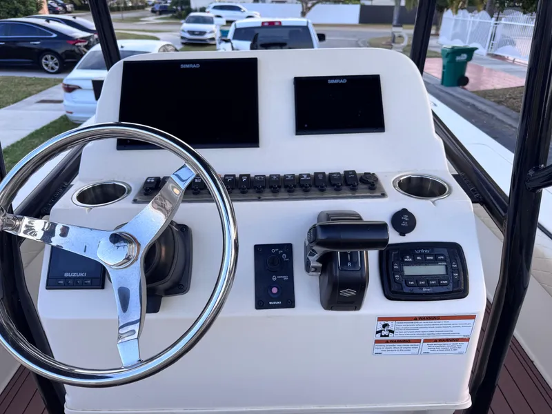 Slide: The Image of Helm of 2021 Carolina Skiff Ultra Elite 24 with dual displays and controls. - 31