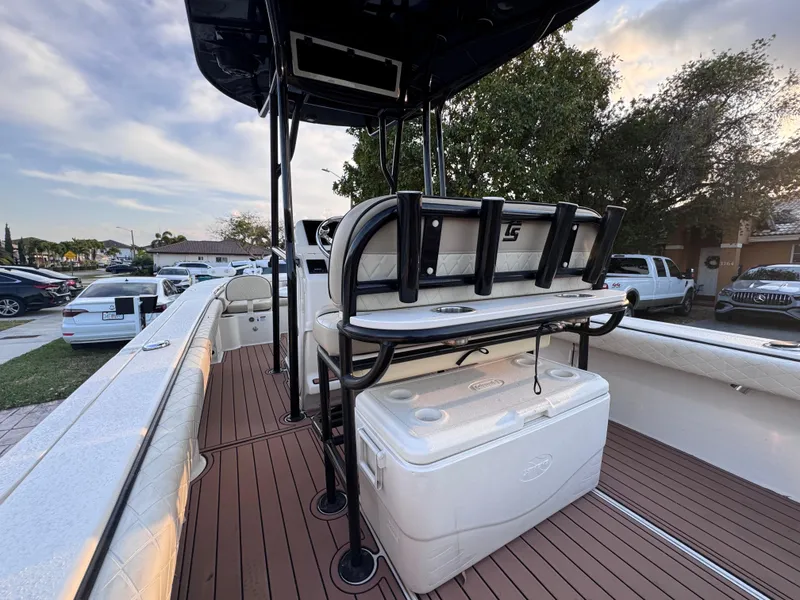 Slide: The Image of 2021 Carolina Skiff Ultra Elite 24 boat interior with seating and cooler on deck. - 33