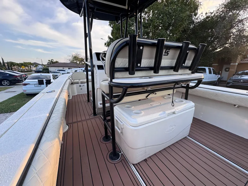 Slide: The Image of 2021 Carolina Skiff Ultra Elite 24 boat interior with seating and rod holders. - 34