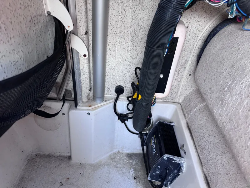 Slide: The Image of Interior view of a 2021 Carolina Skiff Ultra Elite 24 boat, showing wiring and components. - 37