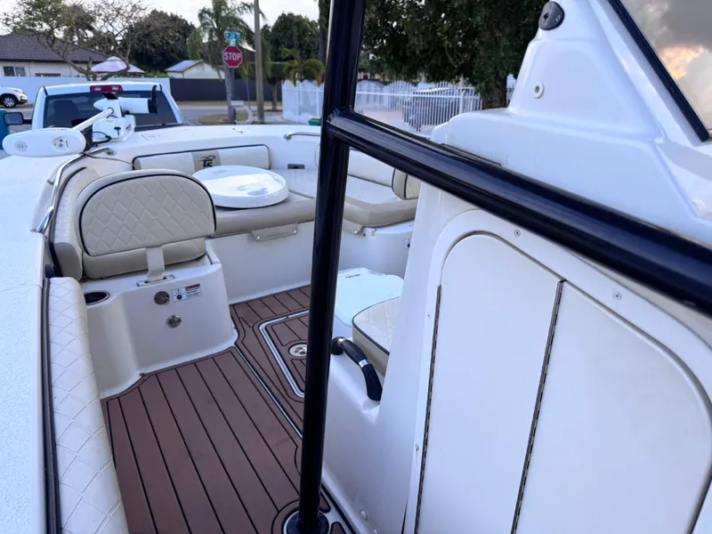 Slide: The Image of 2021 Carolina Skiff Ultra Elite 24 boat interior with seating and wood-style flooring. - 38