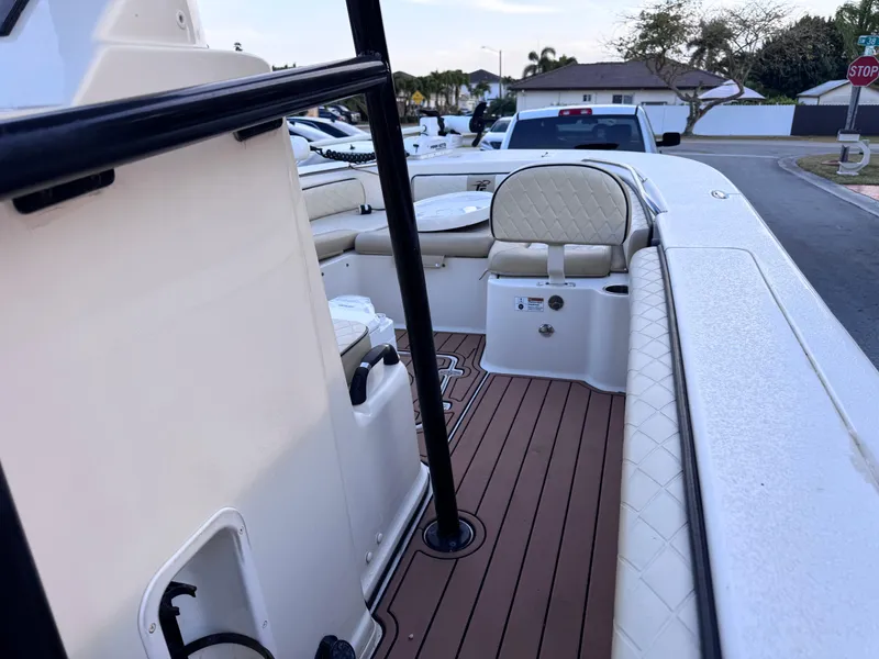 Slide: The Image of 2021 Carolina Skiff Ultra Elite 24 boat interior with seating and wood-style flooring. - 42