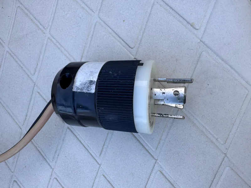 Slide: The Image of Power plug on textured surface, related to 2021 Carolina Skiff Ultra Elite 24 boat. - 47