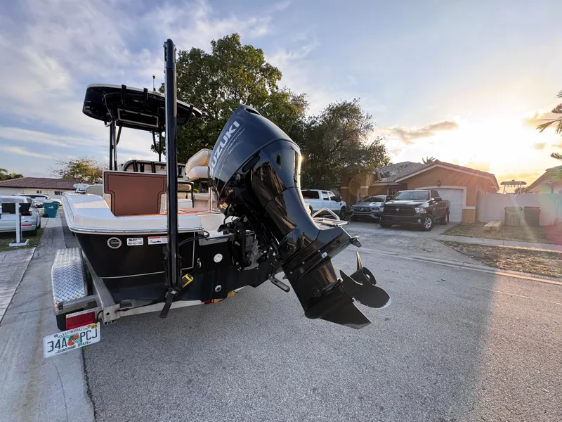 Slide: The Image of 2021 Carolina Skiff Ultra Elite 24 boat with Suzuki outboard motor on a trailer. - 5