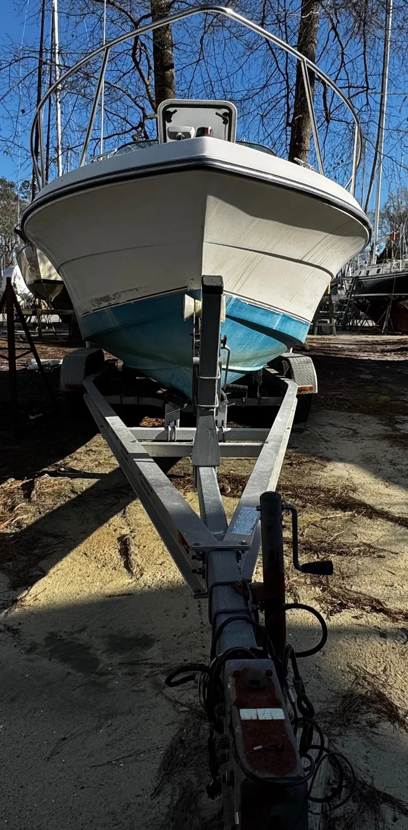 Slide: The Image of 2001 Aquasport 215 Explorer boat on trailer, parked outdoors. - 37