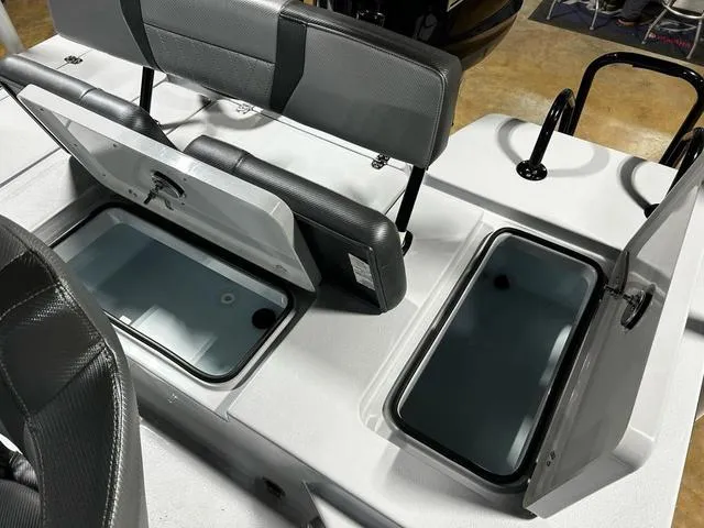 Slide: The Image of 2025 Blazer 675 Ultimate Bay boat with open storage compartments and seating. - 14