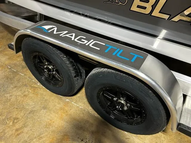 Slide: The Image of Trailer with Magic Tilt branding for 2025 Blazer 675 Ultimate Bay boat. - 16