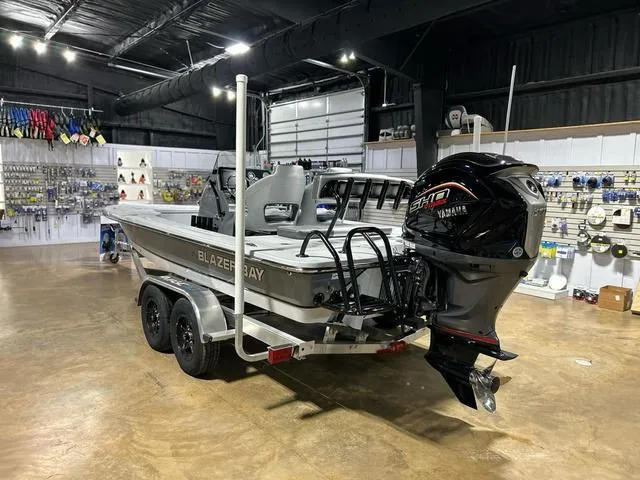 Slide: The Image of 2025 Blazer 675 Ultimate Bay boat with Yamaha engine in showroom. - 4