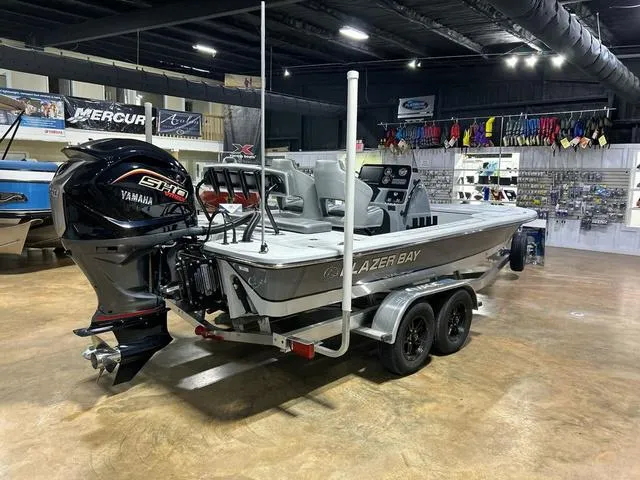 Slide: The Image of 2025 Blazer 675 Ultimate Bay boat with Yamaha engine in showroom. - 6