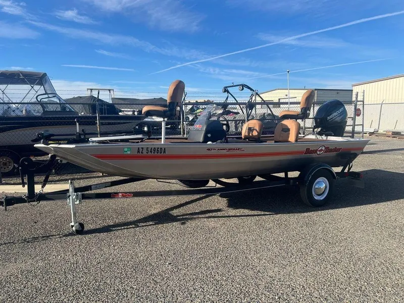 Slide: The Image of 2018 Tracker BASS TRACKER® 40th Anniversary Heritage Edition boat on trailer, parked outdoors. - 22