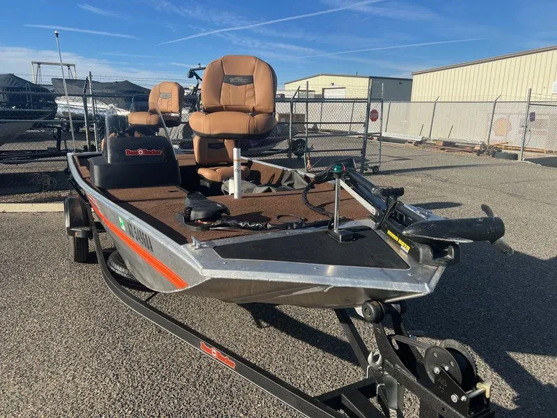 Slide: The Image of 2018 Tracker BASS TRACKER® 40th Anniversary Heritage Edition boat on trailer, parked outdoors. - 3