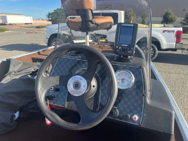 Slide: The Image of 2018 Tracker BASS TRACKER® 40th Anniversary Heritage Edition dashboard with steering wheel and fishfinder. - 7