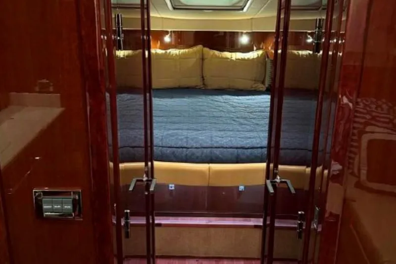 Slide: The Image of Luxurious cabin interior of 2011 Sea Ray 470 Sundancer yacht with plush bedding. - 27