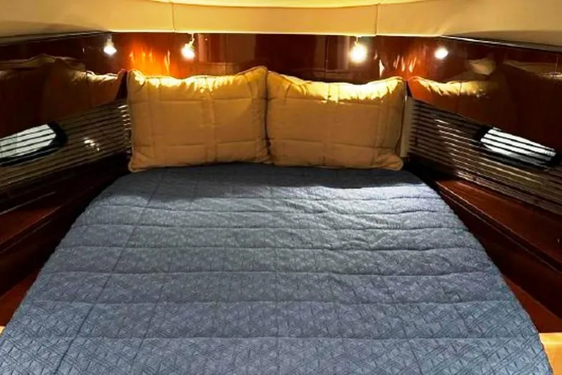 Slide: The Image of Luxurious cabin interior of 2011 Sea Ray 470 Sundancer with cozy bedding. - 28
