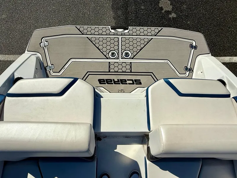 Slide: The Image of 2020 Scarab 215 ID boat interior with cushioned seating and stylish deck design. - 5