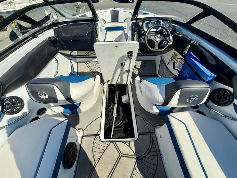 Slide: The Image of Interior of 2020 Scarab 215 ID boat with seating and steering wheel. - 6