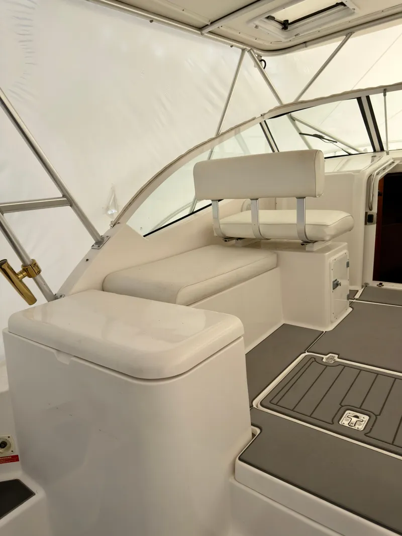 Slide: The Image of 2005 Luhrs 30 Hard Top interior with white seating and modern design. - 9